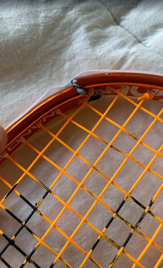 Black Knight Ion Storm racket frame showing hairline crack developing at head